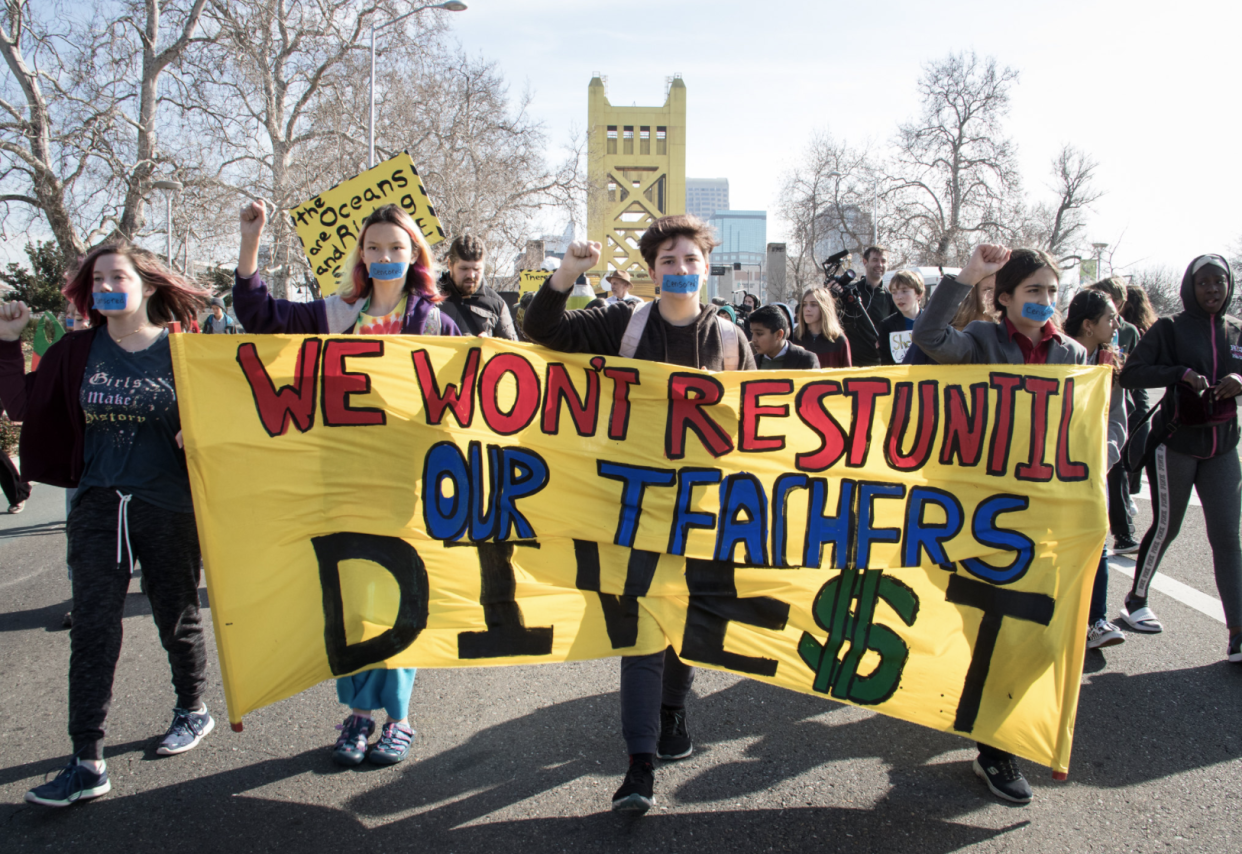 Young people march in Sacramento to protest investment by the California State Teachers’ Retirement System in fossil fuels on Jan. 30, 2020