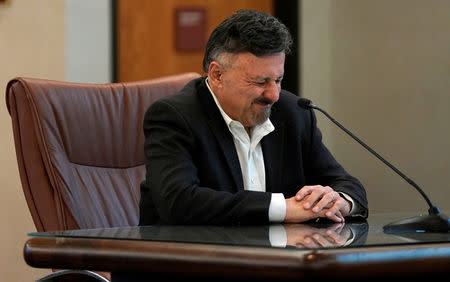 Frank DeAngelis, Columbine High School principal at the time of the 1999 school shooting, listens during a news conference after an armed woman "infatuated" with the Columbine massacre was found dead, according to officials, days ahead of the school shooting's 20th anniversary, in Golden, Colorado, U.S., April 17, 2019. REUTERS/Rick Wilking