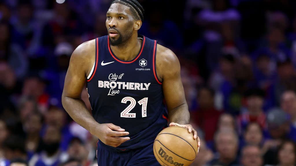 a basketball player holding a basketball