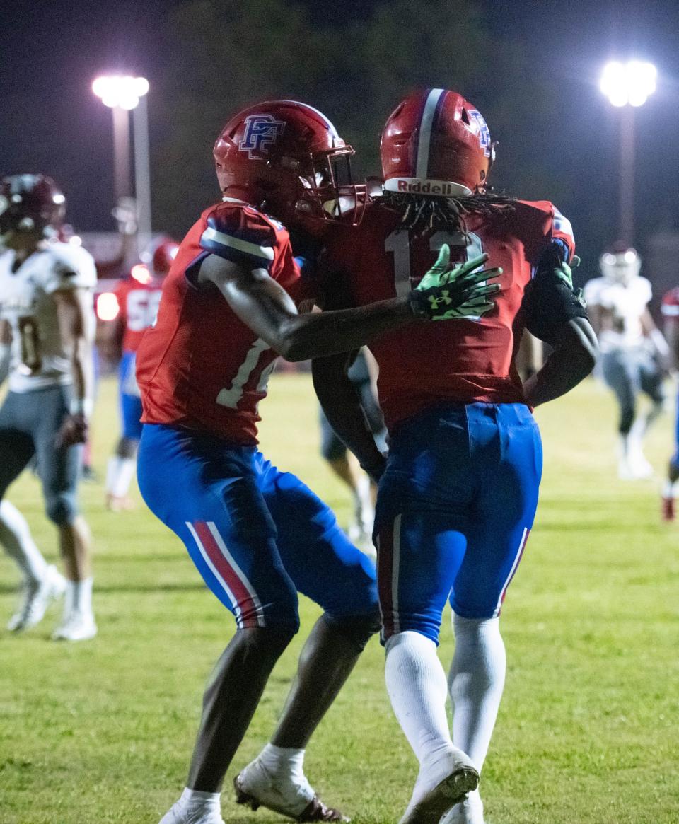 Hasshawn Hackworth (13) is congratulated for taking it in for a touchdown and a 13-7 lead during the Niceville vs Pine Forest football game at Pine Forest High School in Pensacola on Friday, Oct. 7, 2022.