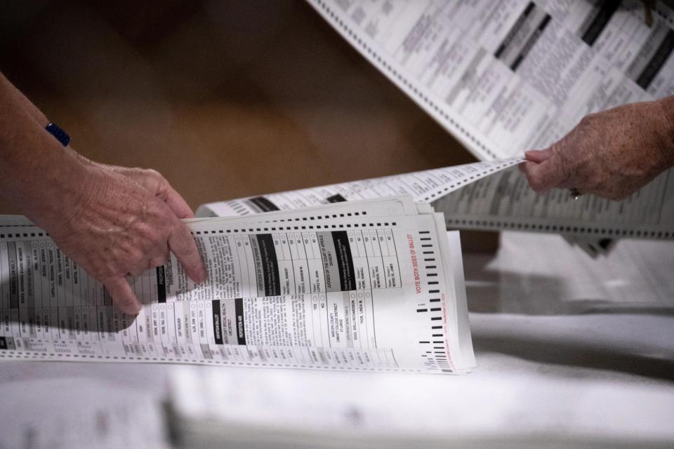 Test ballots are hand counted, July 14, 2021, in the Wesley Bolin Building at the Arizona State Fairgrounds, Phoenix, Arizona.