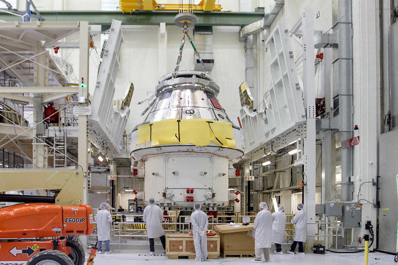 The first Artemis Orion capsule, scheduled for launch late this year atop a Space Launch System rocket, is seen during earlier processing in the Neil Armstrong Operations and Checkout Building at the Kennedy Space Center. / Credit: Lockheed Martin