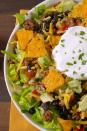 <p>You'll never go back to croutons after this.</p><p>Get the recipe from <a href="https://www.delish.com/cooking/recipe-ideas/recipes/a51235/dorito-taco-salad-recipe/" rel="nofollow noopener" target="_blank" data-ylk="slk:Delish;elm:context_link;itc:0;sec:content-canvas" class="link ">Delish</a>.</p>