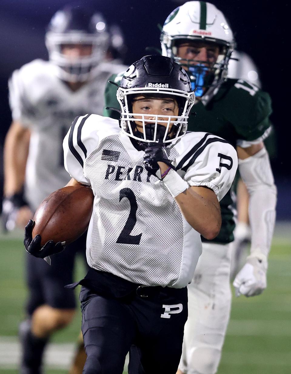 Perry's Roy Simmons runs for a gain in the second half against Central Catholic at Central Thursday, August 18, 2023.