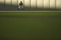 Seattle Mariners center fielder Julio Rodríguez stands in the outfield during the first inning of a baseball game against the Minnesota Twins, Wednesday, May 8, 2024, in Minneapolis. (AP Photo/Abbie Parr)
