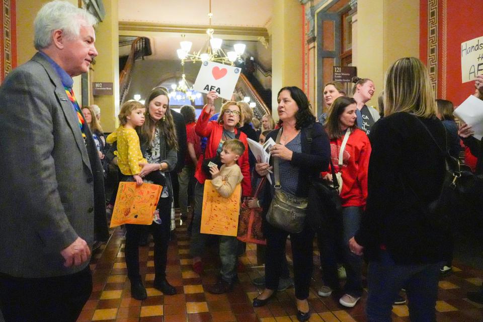 Supporters of AEA wait in the hallway as legislatures leave the public hearing in which Iowans gave their thoughts on the House version of a bill to overhaul the state's Area Education Agencies on Wednesday, Feb. 21, 2024, at Iowa State Capitol in Des Moines.