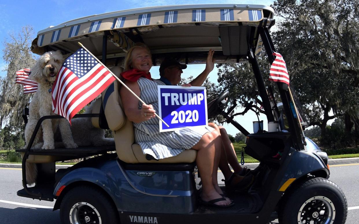 People participate in a golf cart parade in support of the re-election of U.S. President Donald Trump in Florida - Paul Hennessy / Alamy Live News 