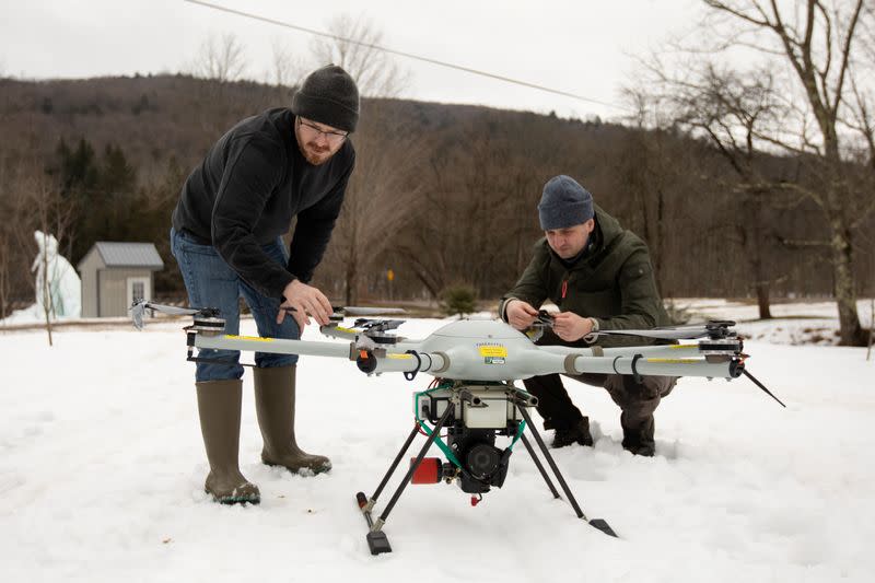 Timothy De Smet and Alex Nikulin prepare a Ukrainian Multirotor Technologies (UMT) Cicada-M drone to fly with a magnetometer to detect abandoned oil wells in Olean, New York