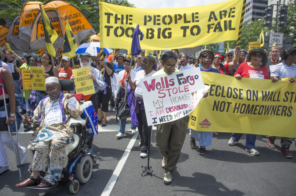 Protesters march to the Department of Justice during a rally against home foreclosures in Washington on May 20, 2013. (Photo: JIM WATSON/GETTY IMAGES)