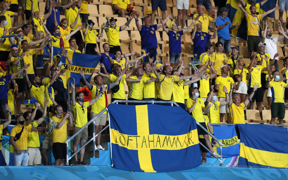 Swedish fans celebrate after the Euro 2020 soccer championship group E match between Spain and Sweden in Sevilla, Spain, Monday, June 14, 2021. (Jose Manuel Vidal/Pool via AP)