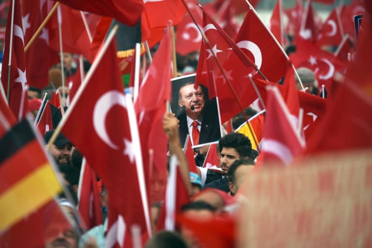 Supporters of Turkish President Recep Tayyip Erdogan rally in Cologne on July 31, 2016