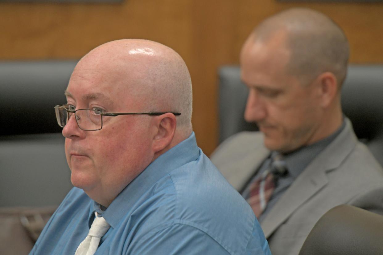 Mark Cooper listens to the proceedings in his retrial Wednesday morning in front of Judge Brent Robinson. Cooper, 57, is accused of causing the death of a Richland County jail inmate in 2019.