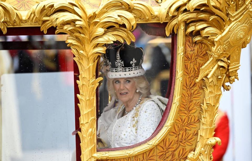 Queen Camilla, wearing a modified version of Queen Mary's Crown leave Westminster Abbey after the Coronation Ceremonies i