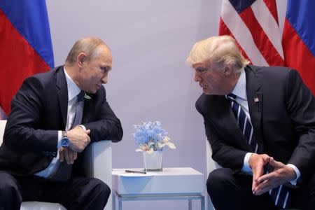 Russia's President Vladimir Putin talks to U.S. President Donald Trump during their bilateral meeting at the G20 summit in Hamburg, Germany. REUTERS/Carlos Barria