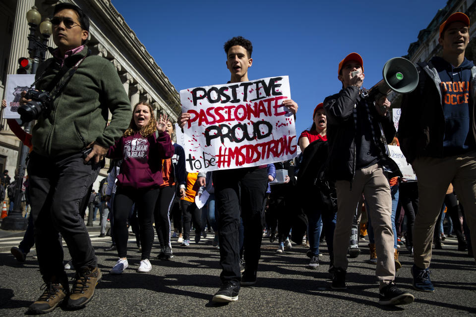 <p>Demonstrators hold signs and shout slogans while marching from the White House to the U.S. Capitol during a school walkout protesting the National Rifle Association (NRA) in Washington, D.C., on Friday, April 20, 2018. (Photo: Al Drago/Bloomberg via Getty Images </p>