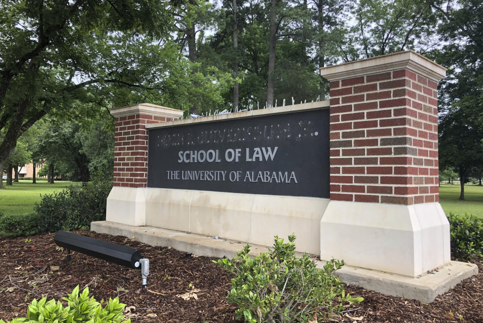 University of Alabama School of Law sign is seen after employees removed the name of donor Hugh F. Culverhouse Jr. in Tuscaloosa, Ala., Friday, June 7, 2019. The University of Alabama board of trustees voted Friday to give back a $26.5 million donation to a philanthropist Hugh F. Culverhouse Jr., who recently called on students to boycott the school over the state's new abortion ban. (AP Photo/Blake Paterson)