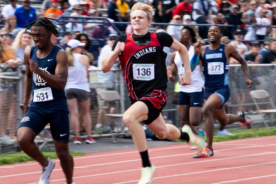 Conemaugh Township Area's Ethan Black (center) turns on the jets to beat West Catholic's Marcel Jackson by 3/100ths of a second in the 2A boys' 200-meter dash at the PIAA Track and Field Championships at Shippensburg University on Saturday, May 28, 2022. 