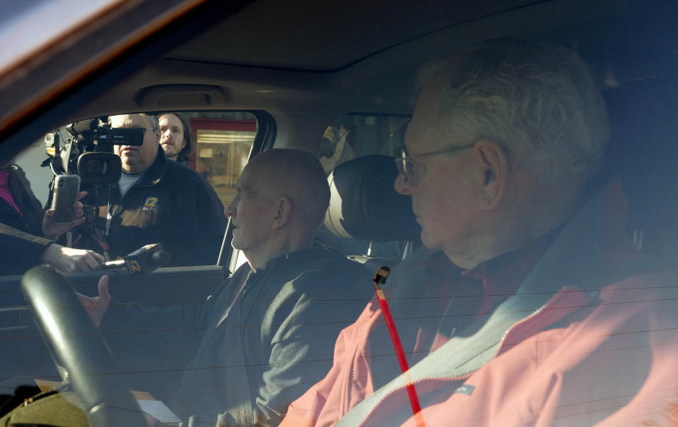 Chester Weger, left, takes questions from the media after being released from the Pickneyville Correctional Center, Friday Feb. 21, 2020, in Pickneyville, Ill. Weger was released from an Illinois prison nearly six decades after he was sentenced to life for the killing of one of three suburban Chicago women whose brutalized bodies were found in a state park. Weger was granted parole in November on his 24th try (Isaac Smith/Chicago Tribune via AP)