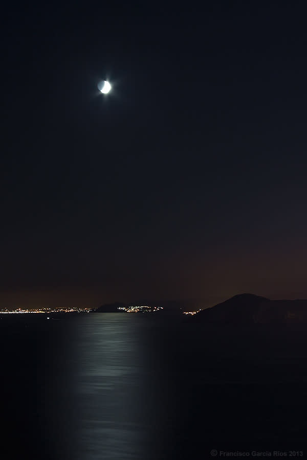 January 3: Moondance by Recesvintus. 'The summer moon, with its shining lights which are reflected on the sea in Benidorm, Spain. On the skyline we can see the different lights of Villajoyosa, Alicante and San Juan.'