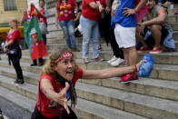 A follower of former Brazilian President Luiz Inacio "Lula" da Silva, who is again running for president, celebrates partial results after general election polls closed in Rio de Janeiro, Brazil, Sunday, Oct. 2, 2022. (AP Photo/Silvia Izquierdo)