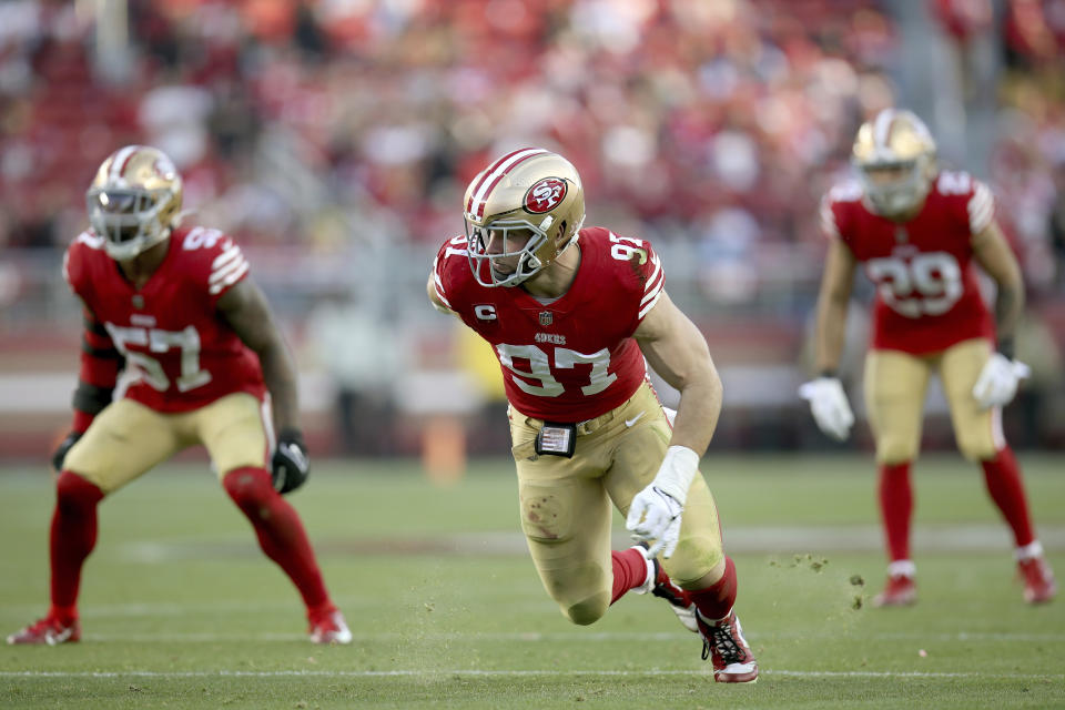 FILE- San Francisco 49ers defensive end Nick Bosa (97) rushes during an NFL football game against the Washington Commanders, on Dec.24, 2022, in Santa Clara, Calif. Dallas star Micah Parsons sees himself and fellow All-Pro edge rusher and NFL sacks leader Nick Bosa of San Francisco as entertainers in their divisional playoff. Even though they won't be on the field together, the meeting Sunday night showcases two of the best young pass rushers in the league. (AP Photo/Scot Tucker, File)