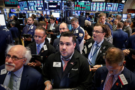 Traders work on the floor of the New York Stock Exchange (NYSE) in New York, U.S., September 20, 2018. REUTERS/Brendan McDermid