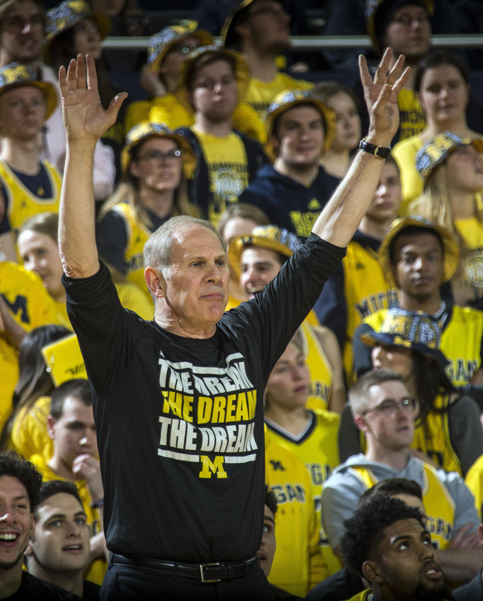 Michigan head coach John Beilein signals to his players from court side in the first half of an NCAA college basketball game against Minnesota at Crisler Center in Ann Arbor, Mich., Tuesday, Jan. 22, 2019. Michigan won 59-57. (AP Photo/Tony Ding)