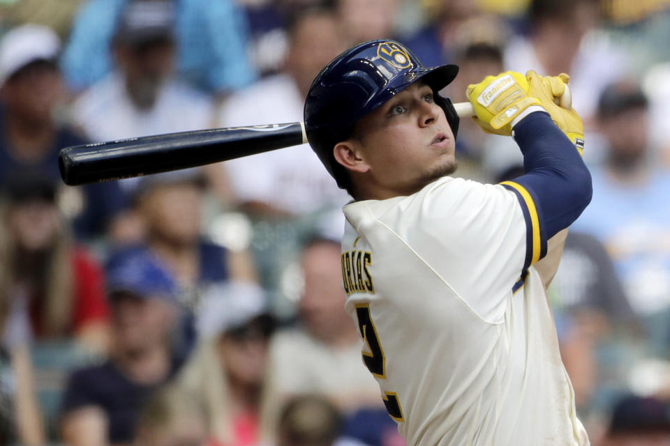 Milwaukee Brewers' Luis Urias hits a two-run home run during the fifth inning of a baseball game against the Minnesota Twins, Wednesday, July 27, 2022, in Milwaukee. (AP Photo/Aaron Gash)