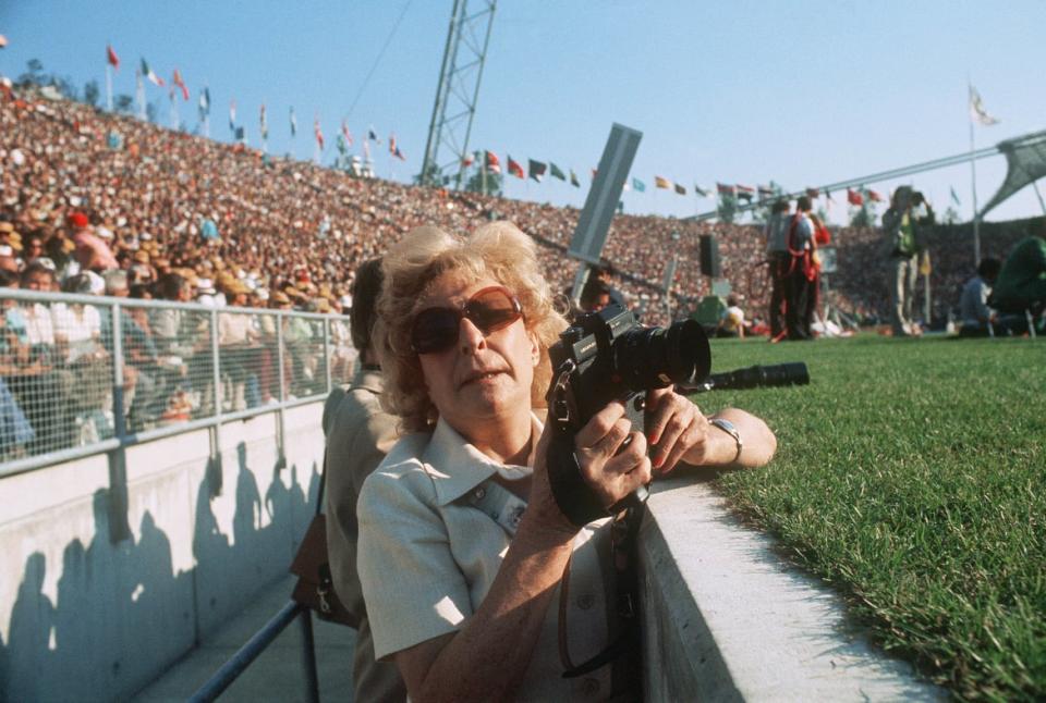 <div class="inline-image__caption"><p>Leni Riefenstahl, German photographer and filmmaker notorious for her artistic collaboration with Adolf Hitler, takes pictures on August 27, 1972, in the Olympic stadium in Munich during the 1972 Olympic games. </p></div> <div class="inline-image__credit">AFP/Getty</div>