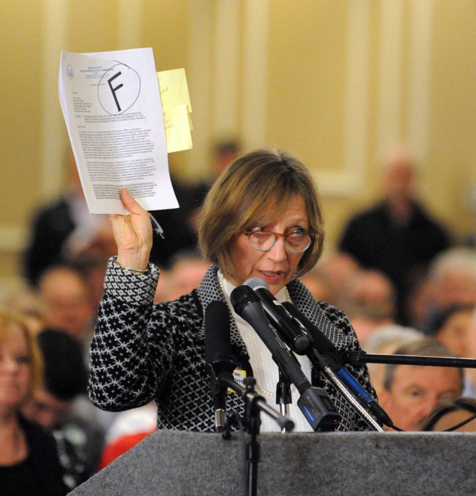 In March 2015, Cape Down Wind spokeswoman Diane Turco of Harwich holds up the grade the NRC gave Pilgrim Nuclear power plant during their meeting at the Radisson in Plymouth. RON SCHLOERB/CAPE COD TIMES