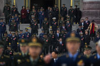 Chinese military officers leave the Great Hall of the People after attending a preparatory session of the National People's Congress (NPC) in Beijing, Monday, March 4, 2024. (AP Photo/Andy Wong)