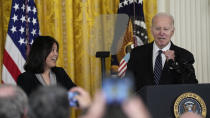 President Joe Biden talks about his nomination of Julie Su, left, to serve as the Secretary of Labor during an event in the East Room of the White House in Washington, Wednesday, March 1, 2023. (AP Photo/Susan Walsh)