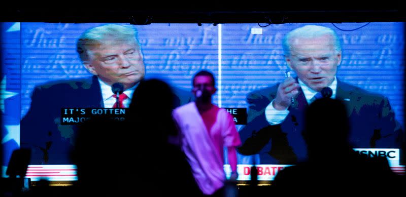 People watch the second 2020 presidential campaign debate between Democratic presidential nominee Joe Biden and U.S. President Donald Trump at The Abbey Bar during the outbreak of the coronavirus disease (COVID-19), in West Hollywood