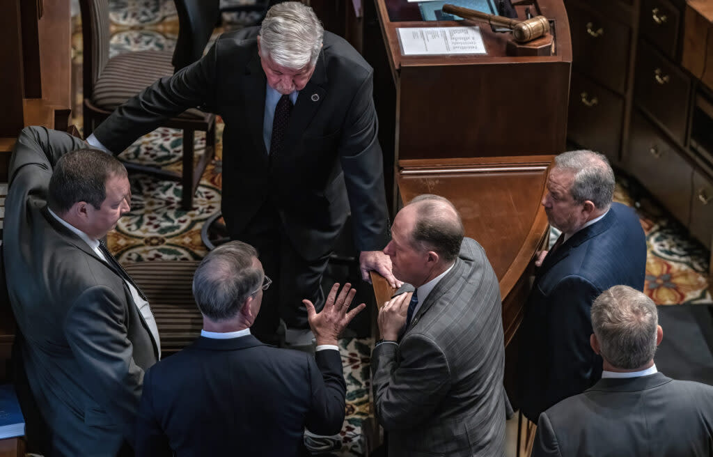 Tennessee Senate leaders, including Lt. Gov. Randy McNally (top) and House Majority Leader Jack Johnson (second from right), put their heads together in the Senate chambers. (Photo: John Partipilo)