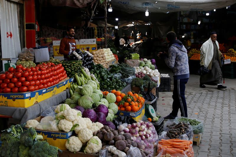 A man sells vegetables in Falluja