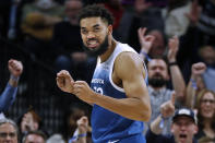 Minnesota Timberwolves forward Karl-Anthony Towns celebrates his 3-point basket against the Atlanta Hawks during the fourth quarter of an NBA basketball game Friday, April 12, 2024, in Minneapolis. (AP Photo/Bruce Kluckhohn)