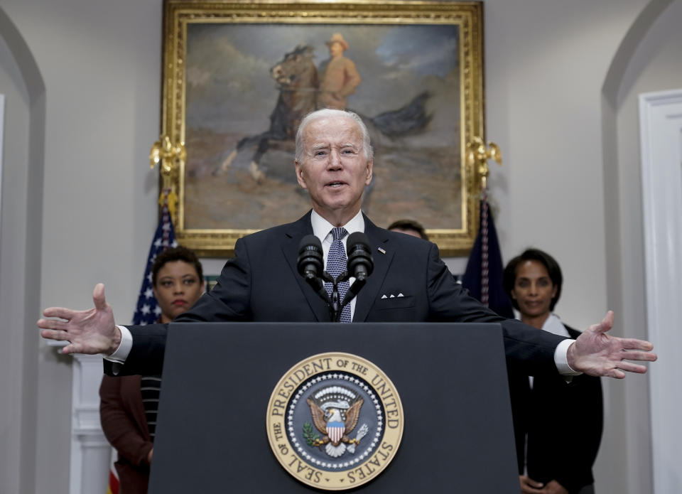 President Joe Biden speaks about deficit reduction, in the Roosevelt Room at the White House in Washington, Friday, Oct. 21, 2022. Biden is flanked by, Office of Management and Budget Director Shalanda Young, left, and Council of Economic Advisers Chairwoman Cecilia Rouse. (AP Photo/J. Scott Applewhite)