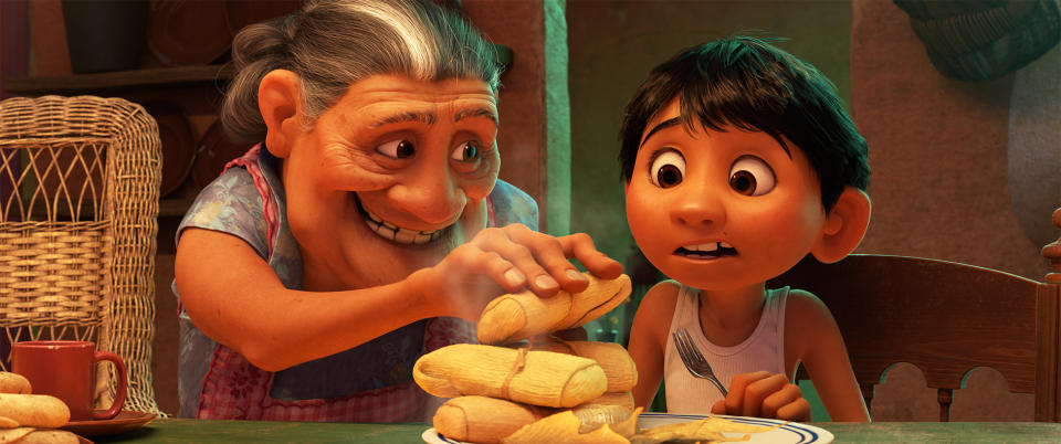 MORE TAMALES -- In Disney•Pixar’s “Coco,” Abuelita—Miguel’s loving grandmother—runs the Rivera household like Mamá Imelda did two generations before her. Their philosophy is simple: Work in the family shoemaking business, eat more tamales and, most importantly, “No music!” Featuring the voices of Renée Victor as Abuelita and Anthony Gonzalez as Miguel, Disney•Pixar’s “Coco” opens in U.S. theaters on Nov. 22, 2017. ©2017 Disney•Pixar. All Rights Reserved.