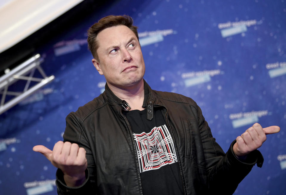 FILE - SpaceX owner and Tesla CEO Elon Musk arrives on the red carpet for the Axel Springer media award, in Berlin, Germany, Tuesday, Dec. 1, 2020. Many people are puzzled on what a Elon Musk takeover of Twitter would mean for the company and even whether he’ll go through with the deal. If the 50-year-old Musk’s gambit has made anything clear it’s that he thrives on contradiction. (Britta Pedersen/Pool via AP, File)