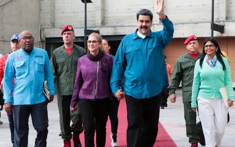 Venezuela's President Nicolas Maduro and his wife Cilia Flores, attend a meeting with supporters in Caracas - Credit: &nbsp;REUTERS&nbsp;