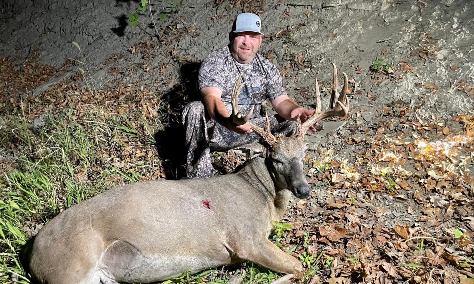 photo of a Kansas hunter with a big whitetail buck