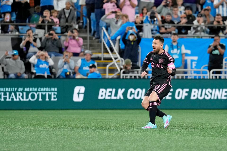 Inter Miami CF forward Lionel Messi reacts after taking a free kick against Charlotte FC.