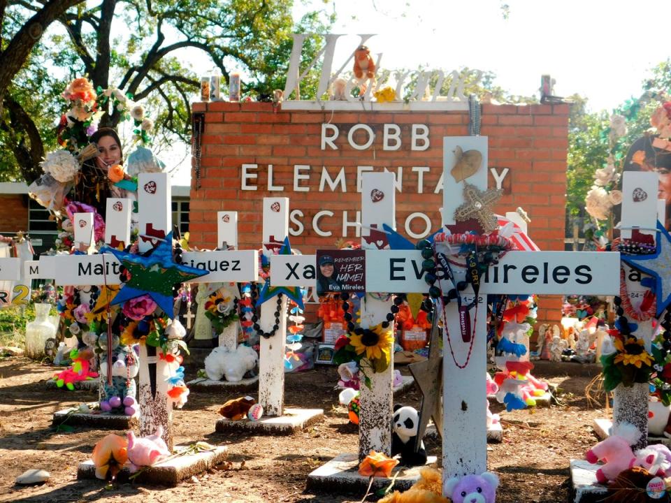 A memorial for the 19 children and two teachers killed in the May shooting sits outside the school (AP)