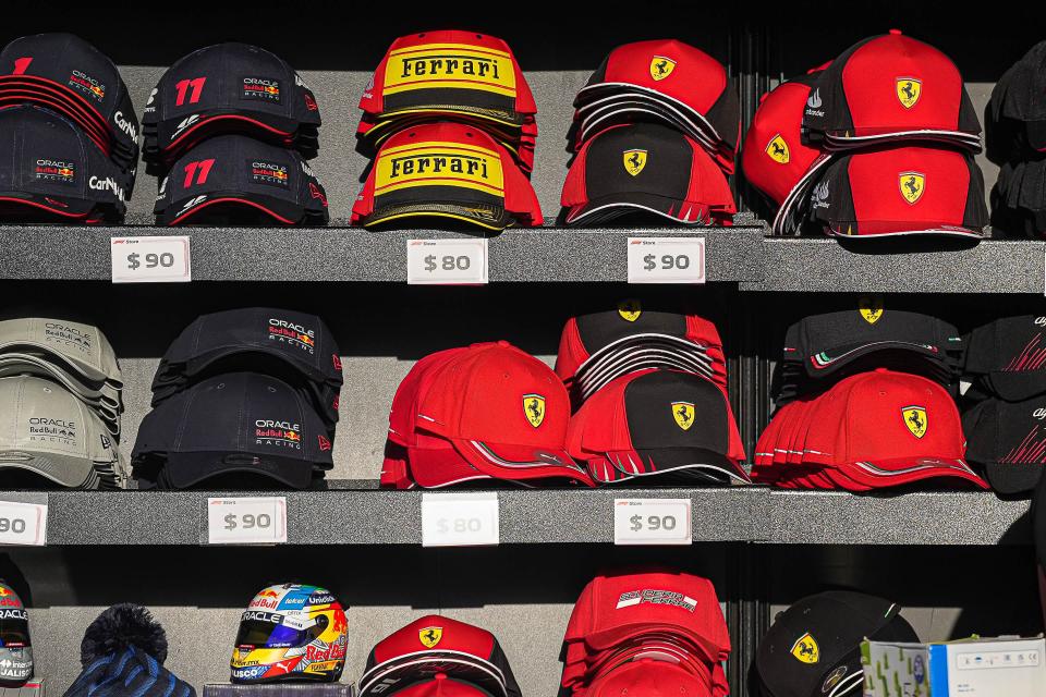 Formula One team hats line the shelves of a booth in the Grand Plaza at Circuit of the Americas on Friday. The circuit's 11th U.S. Grand Prix F1 race will be held Sunday.