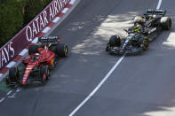 Mercedes driver Lewis Hamilton of Britain, right, and Ferrari driver Charles Leclerc of Monaco steer their cars during the Formula One second practice session at the Monaco racetrack, in Monaco, Friday, May 26, 2023. The Formula One race will be held on Sunday. (AP Photo/Luca Bruno)