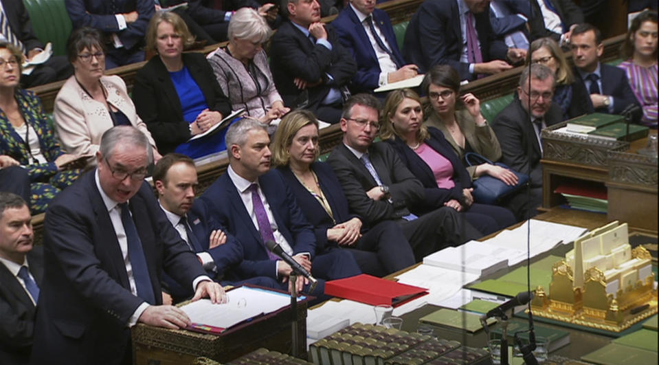 In this grab taken from video, Britain's Attorney General Geoffrey Cox gives his legal opinion during the Brexit debate in the House of Commons, in London, Tuesday March 12, 2019. Cox said changes announced late Monday "reduce the risk" Britain could be stuck inside EU regulations indefinitely — but do not eliminate it. The two-page opinion said the U.K. could still not extract itself from the terms of the divorce deal unilaterally, a key demand of pro-Brexit British politicians. (House of Commons /PA via AP)