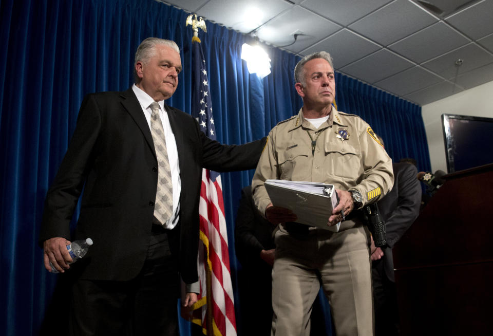 Clark County Commissioner Steve Sisolak, left, and Las Vegas Metropolitan Police Department Sheriff Joe Lombardo leave a media briefing at police headquarters in Las Vegas on Wednesday. (Photo: Steve Marcus/Las Vegas Sun via AP)