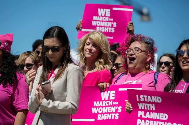 FILE PHOTO: Former Texas State Senator Wendy Davis (C), attends a Planned Parenthood rally outside the State Capitol in Austin