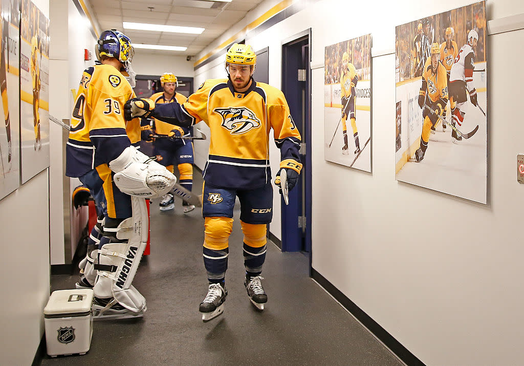 NASHVILLE, TN - OCTOBER 22: Frederick Gaudreau #32 taps goalie Marek Mazanec #39 of the Nashville Predators as he walks out for his first NHL game on October 22, 2016 at Bridgestone Arena against the Pittsburgh Penguins in Nashville, Tennessee. (Photo by John Russell/NHLI via Getty Images)