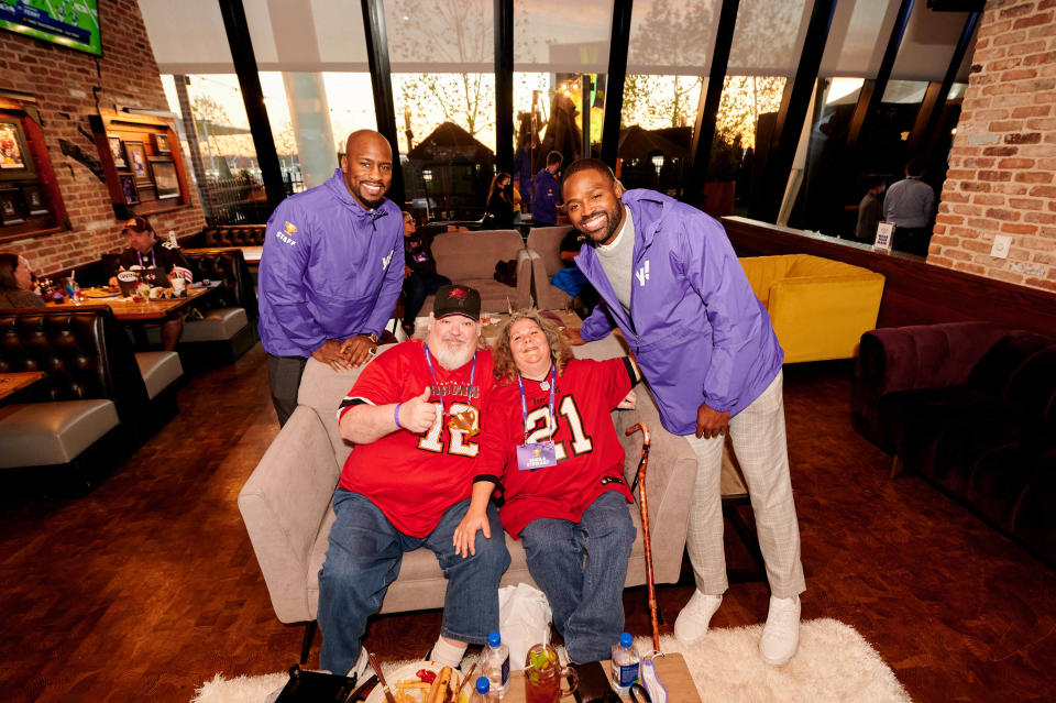 Yahoo Fantasy Football Championship second-place finisher, Scott Stewart, with his wife, Sheila, and event special guests Vernon Davis (left) and Torrey Smith (right).
